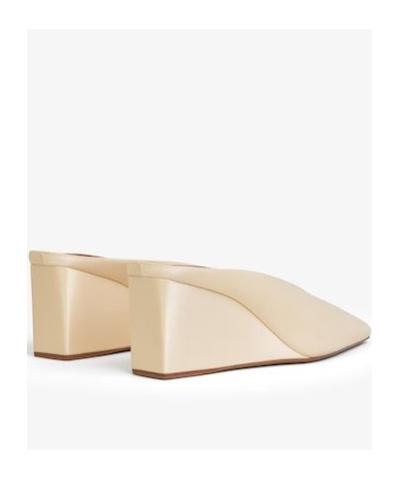 ALAÏA CUBE WEDGE MULES IN SATIN