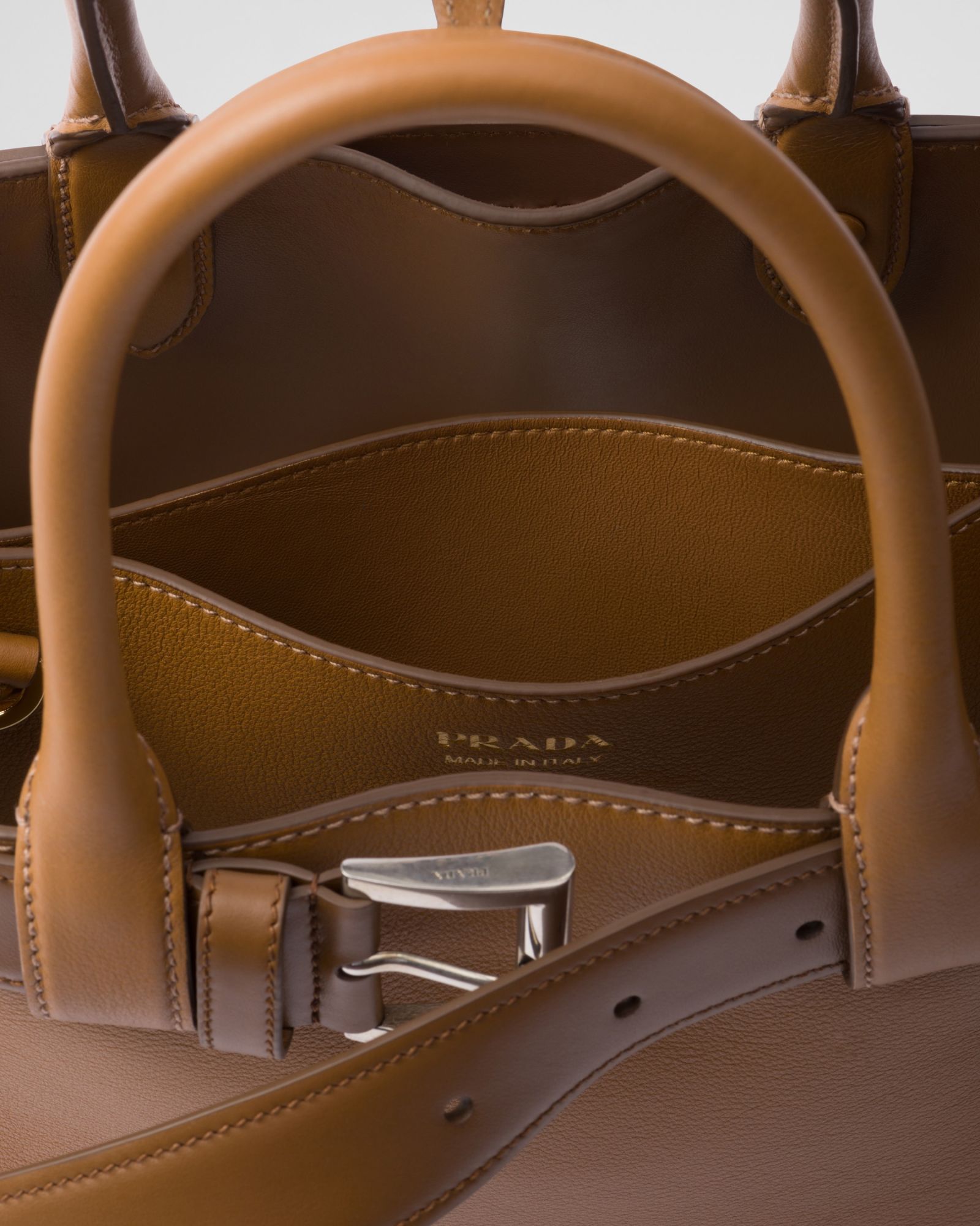 Prada Medium Logo Leather Top Handle Bag In Brown