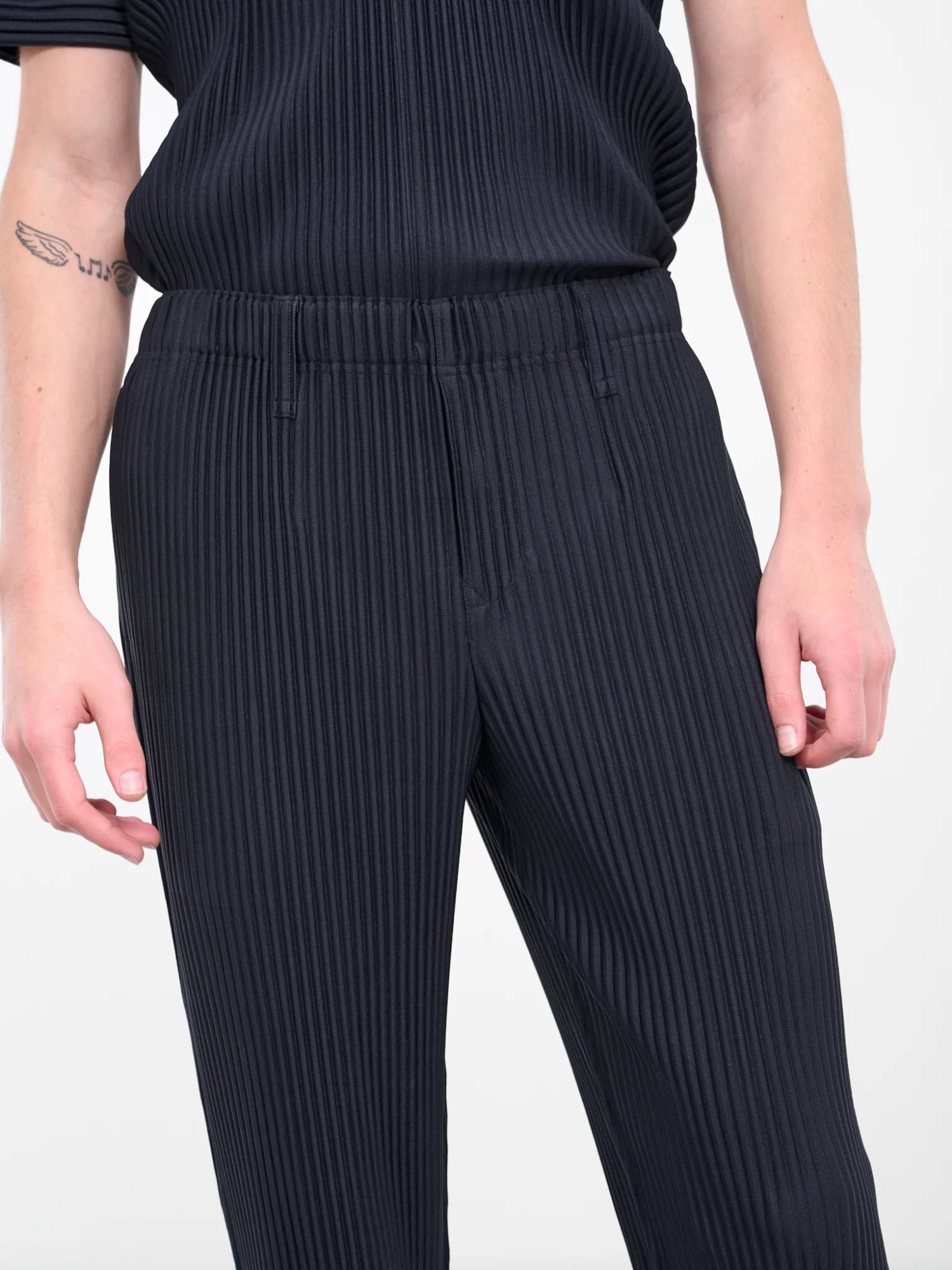 Shop Issey Miyake Basic Tapered Plissé Trousers In Black
