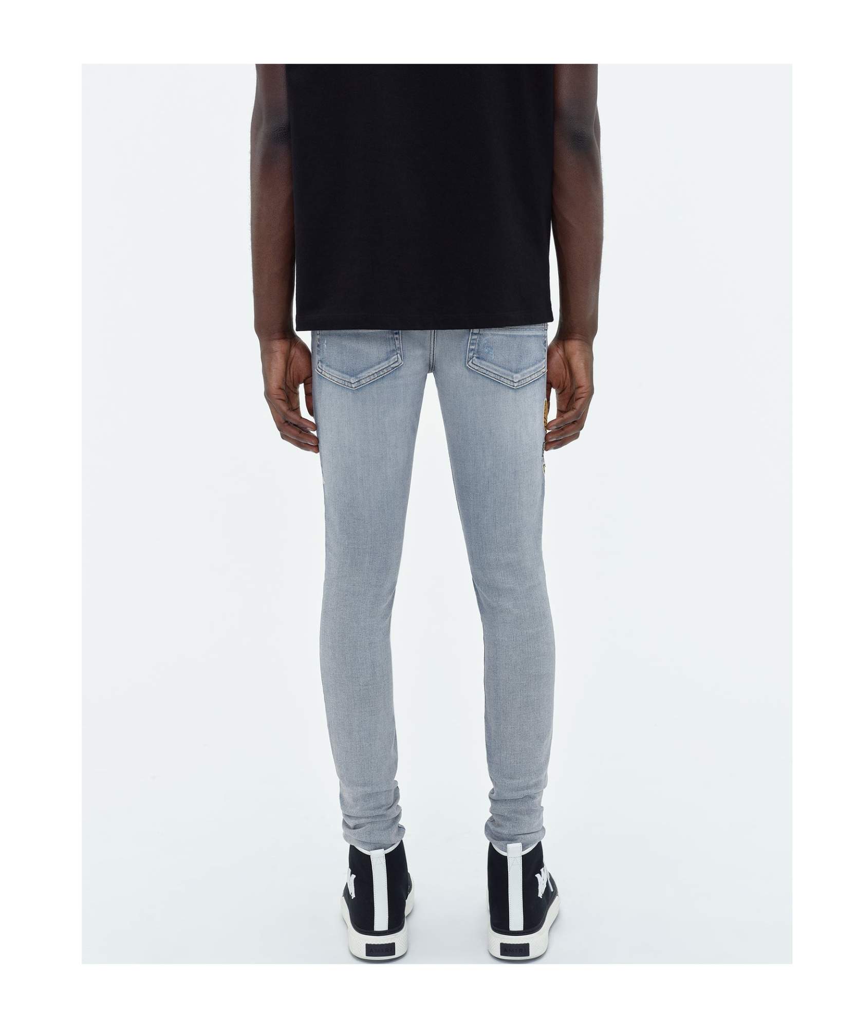 AMIRI LOGO-APPLIQUÉ SKINNY JEANS