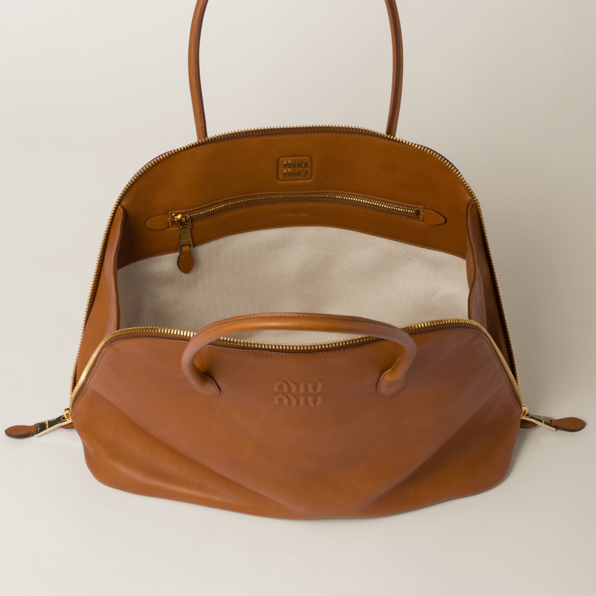 Miu Miu Embossed-logo Tote Bag In Brown