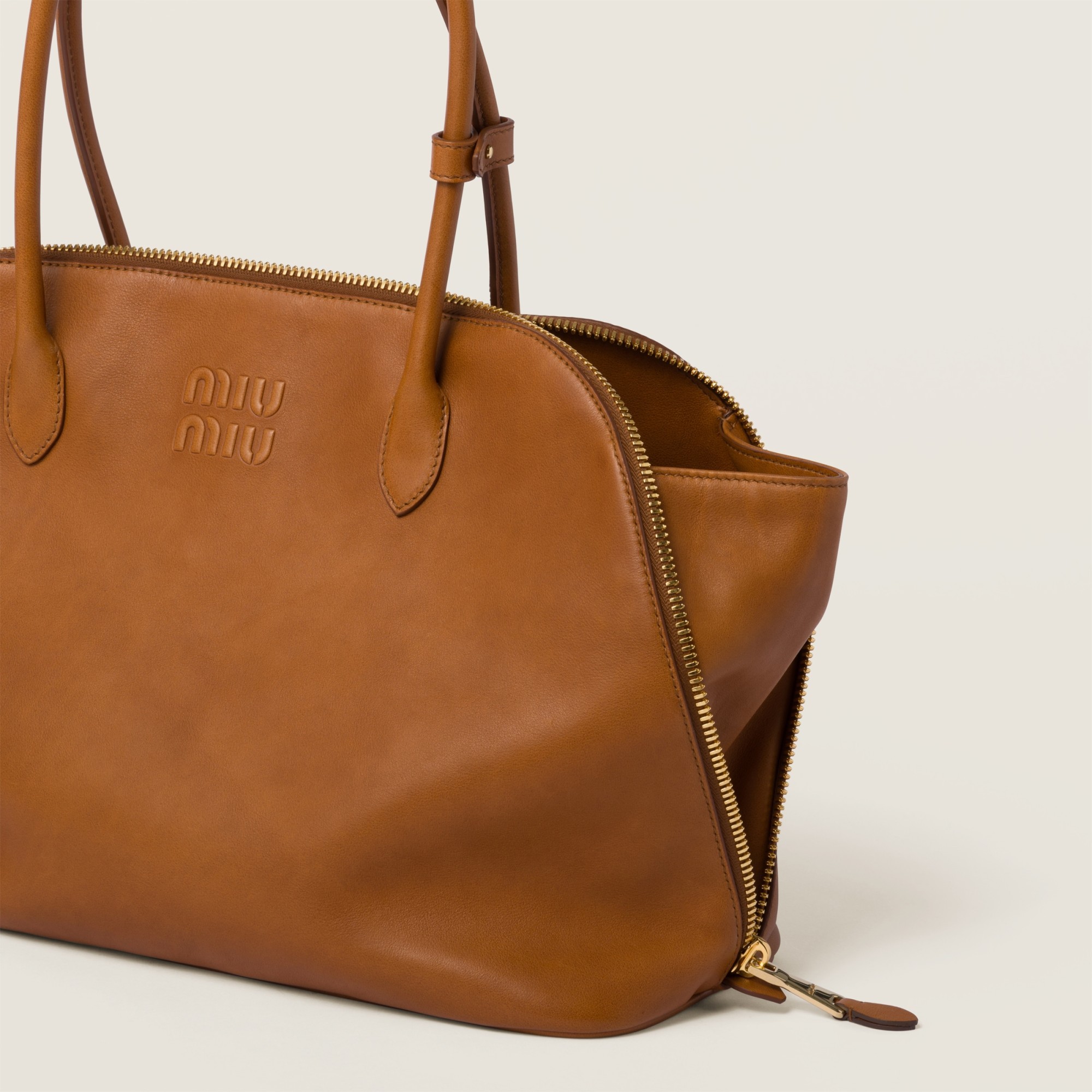 Miu Miu Embossed-logo Tote Bag In Brown