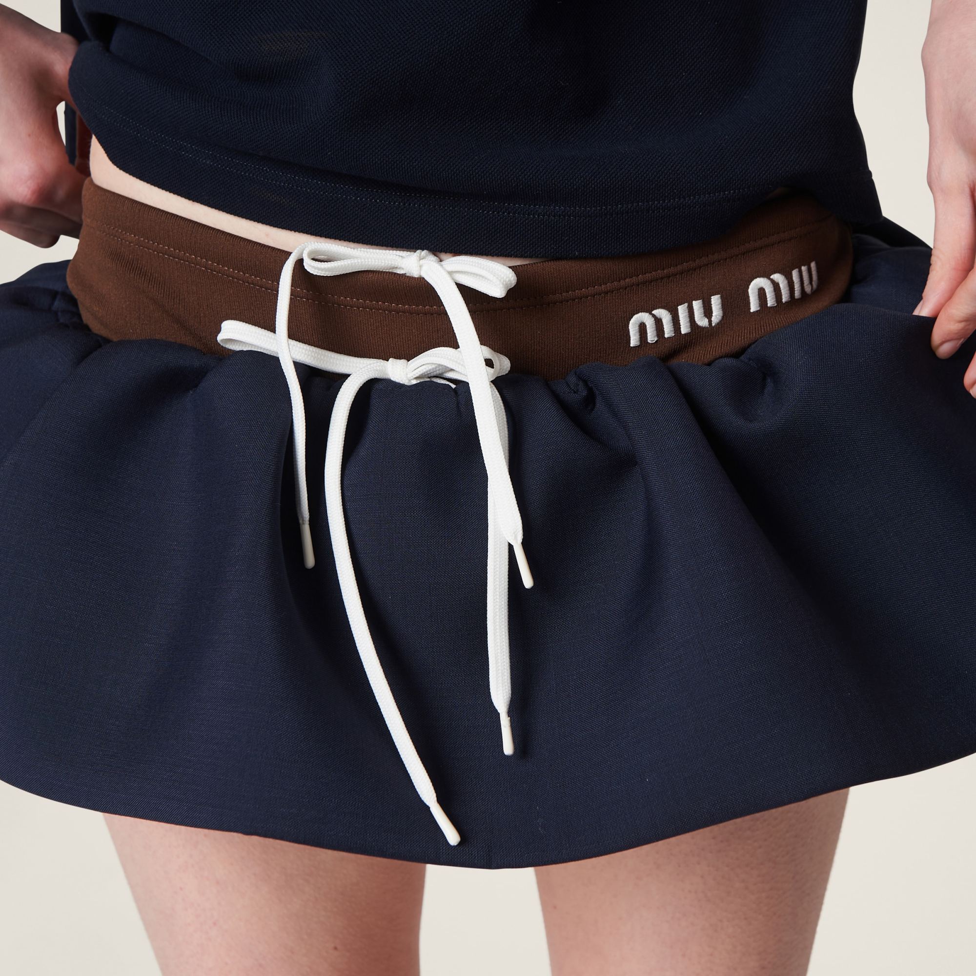 Miu Miu Logo-appliqué Wool Miniskirt In Blue