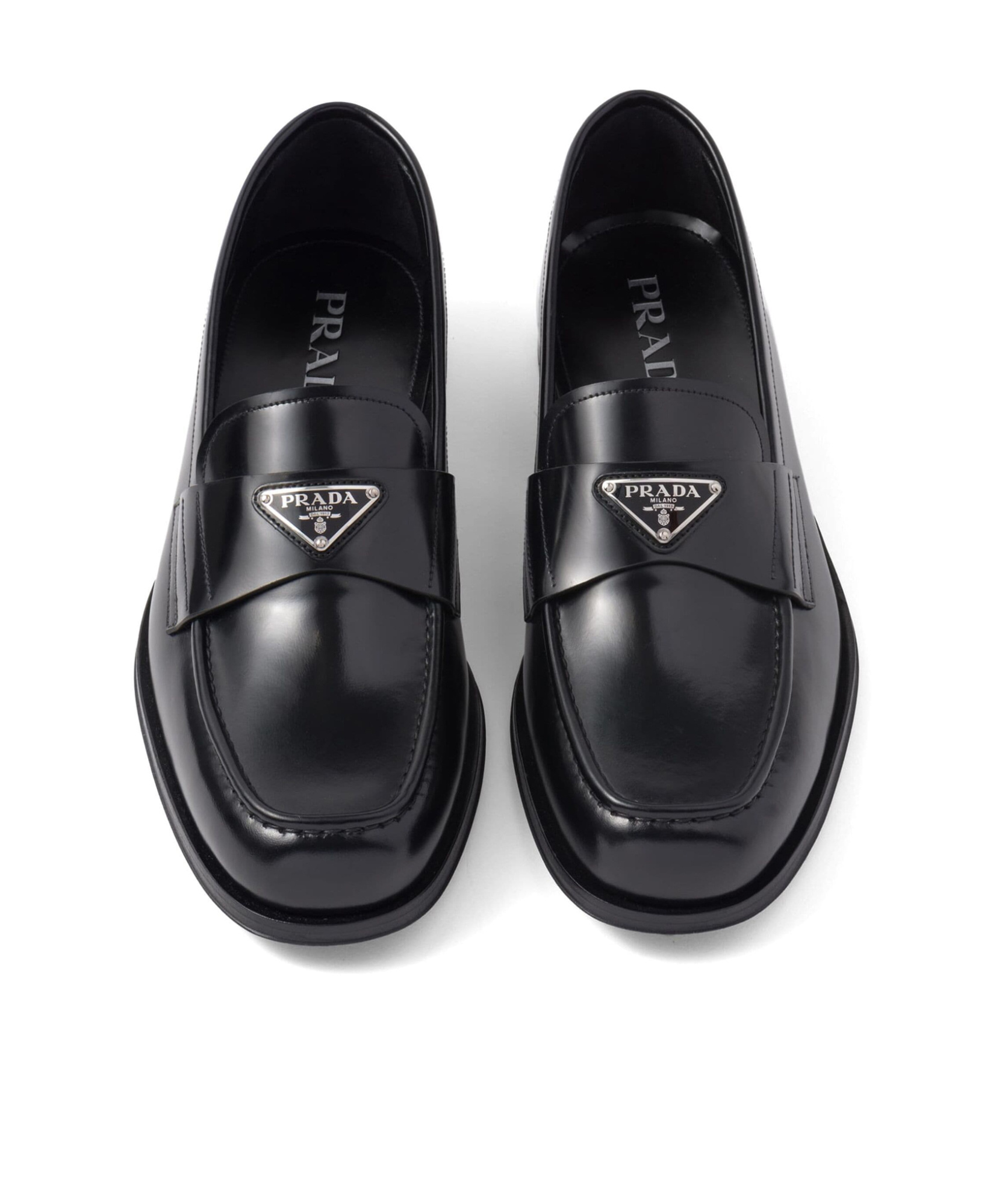 Prada Triangular Plaque Loafers In Black