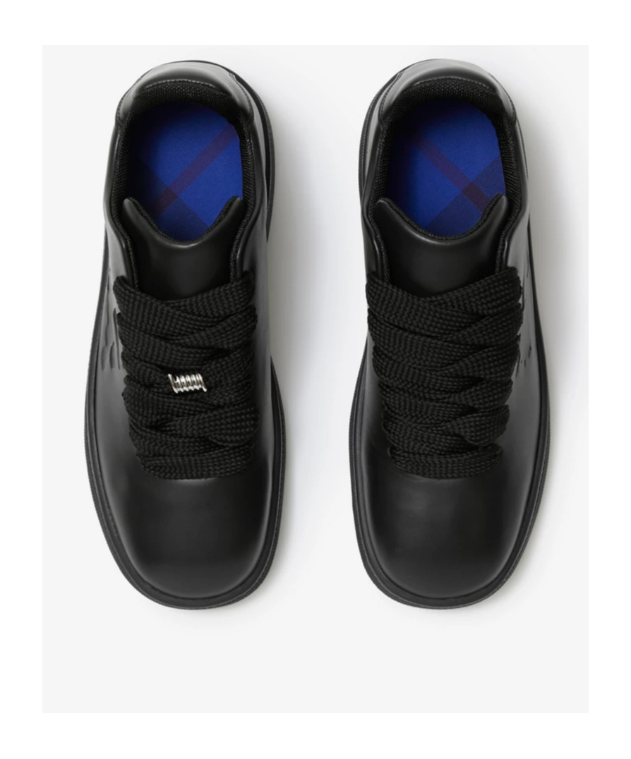 Shop Burberry Ekd Logo-embossed Leather Sneakers In Black