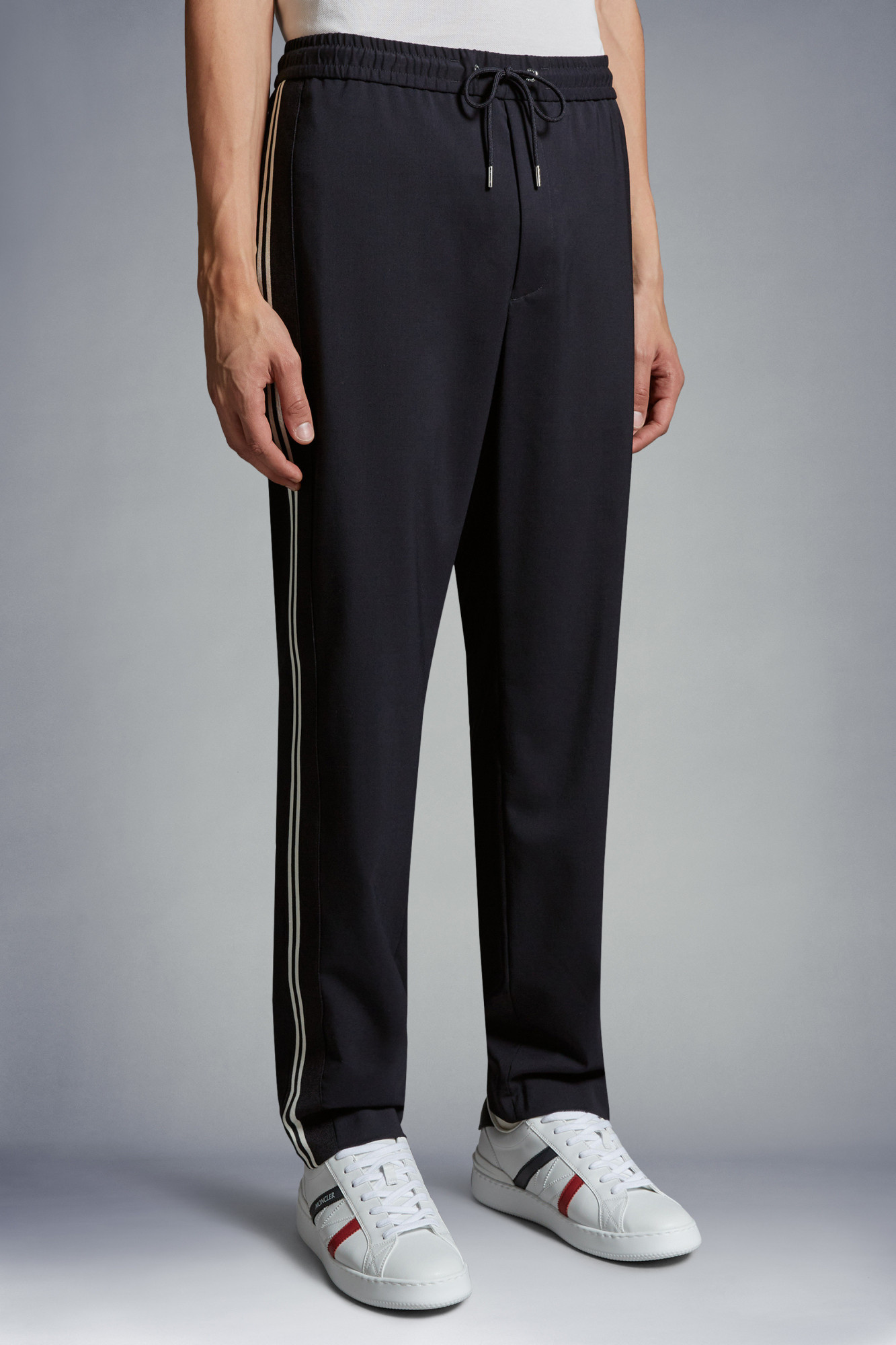 Moncler Logo-embroidered Tapered Trousers In Black