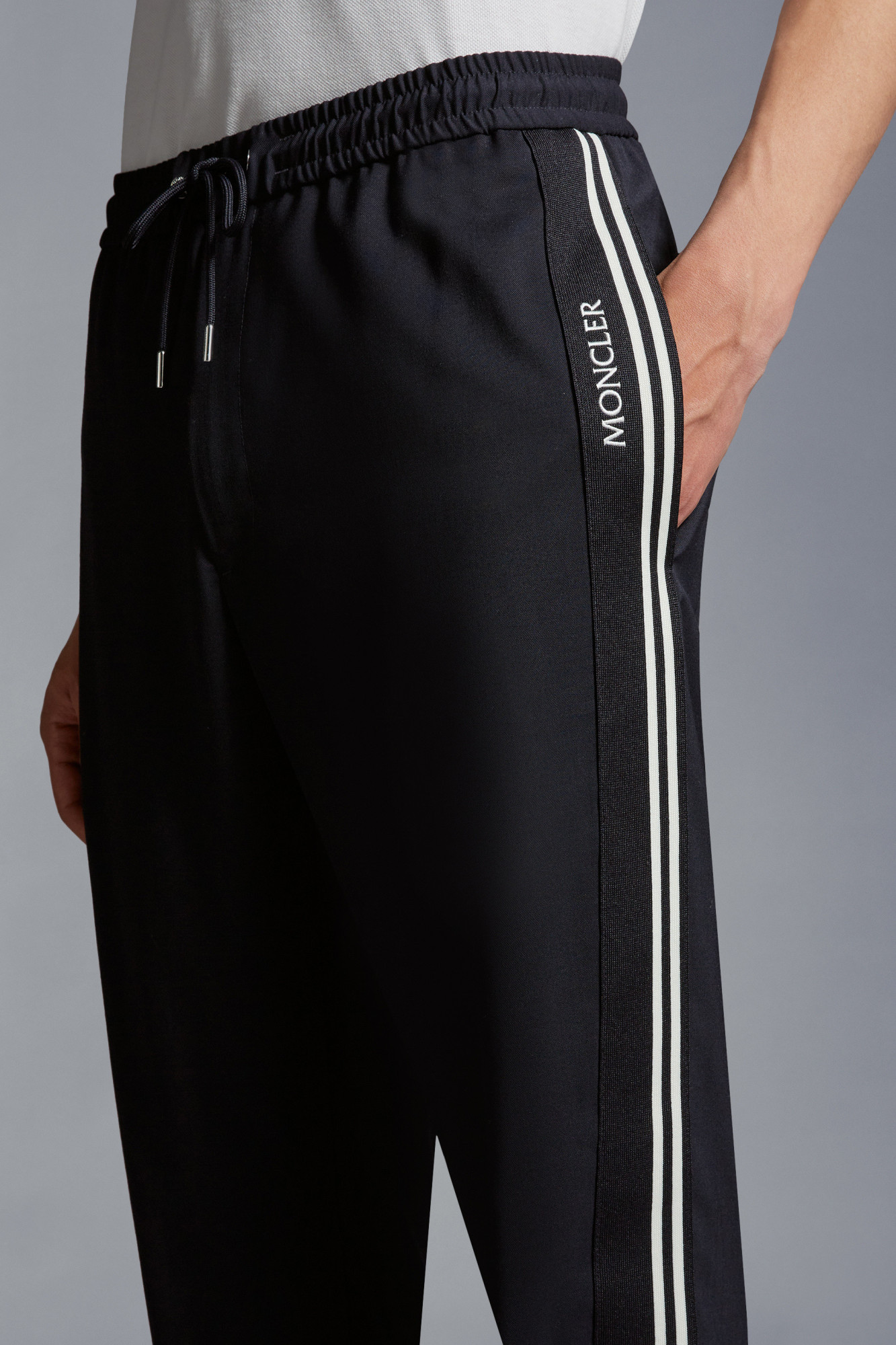 Moncler Logo-embroidered Tapered Trousers In Black