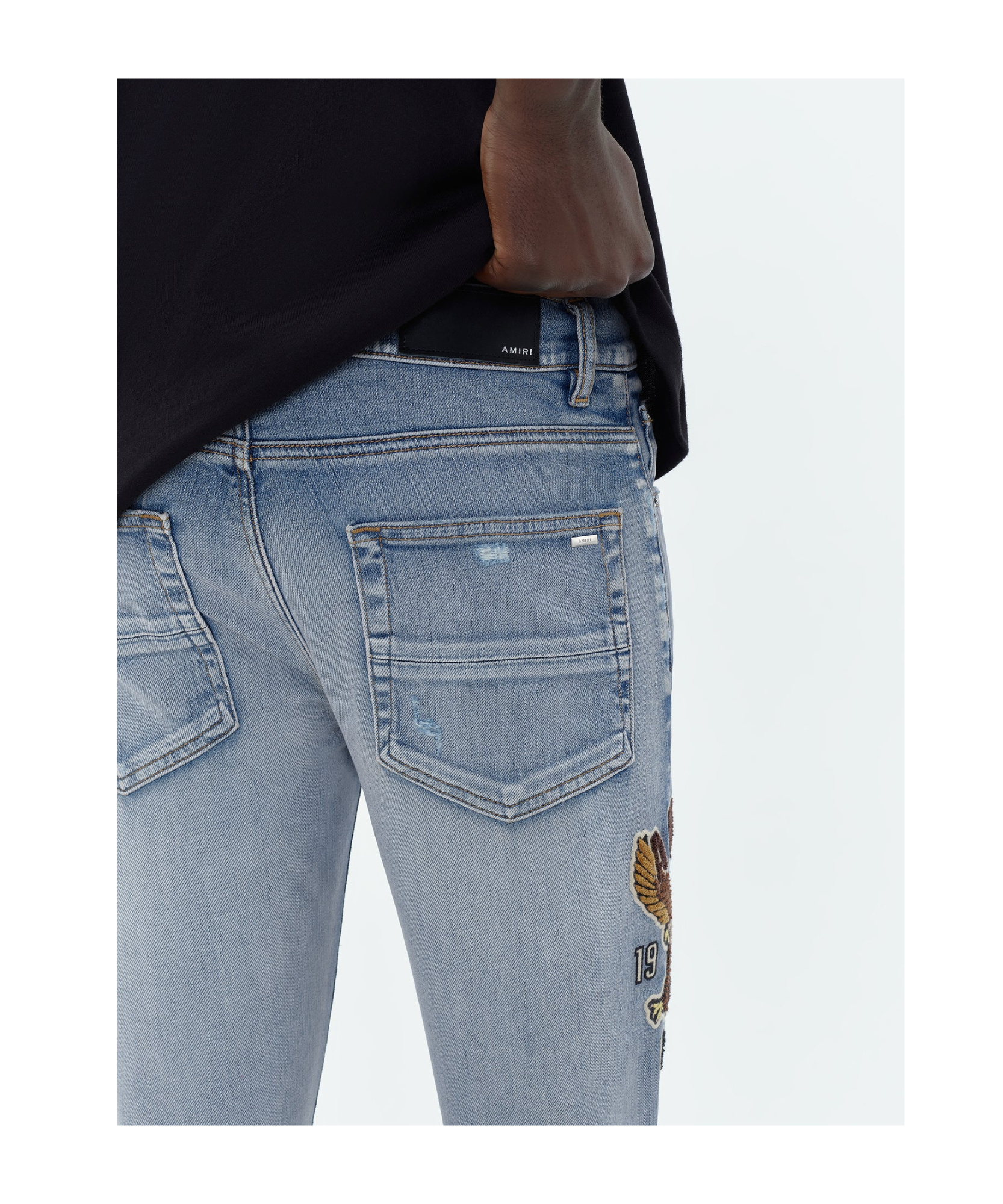 Shop Amiri Logo-appliqué Skinny Jeans In Blue