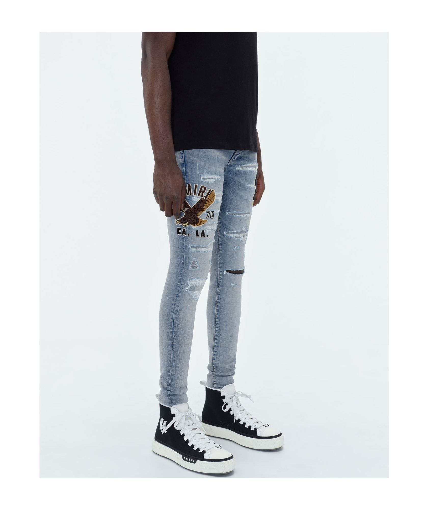 AMIRI LOGO-APPLIQUÉ SKINNY JEANS