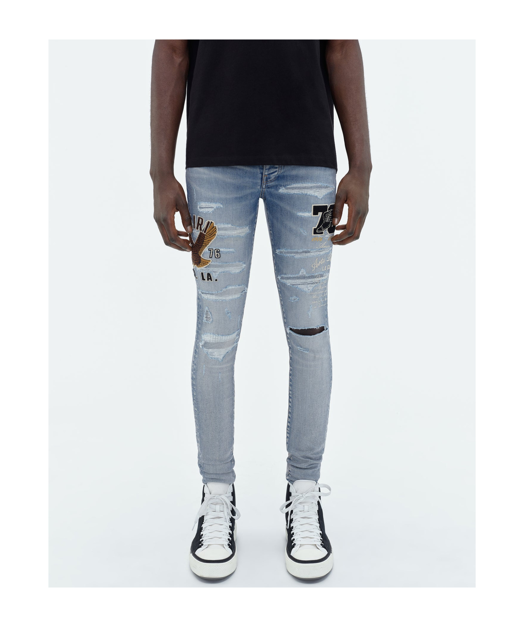 AMIRI LOGO-APPLIQUÉ SKINNY JEANS