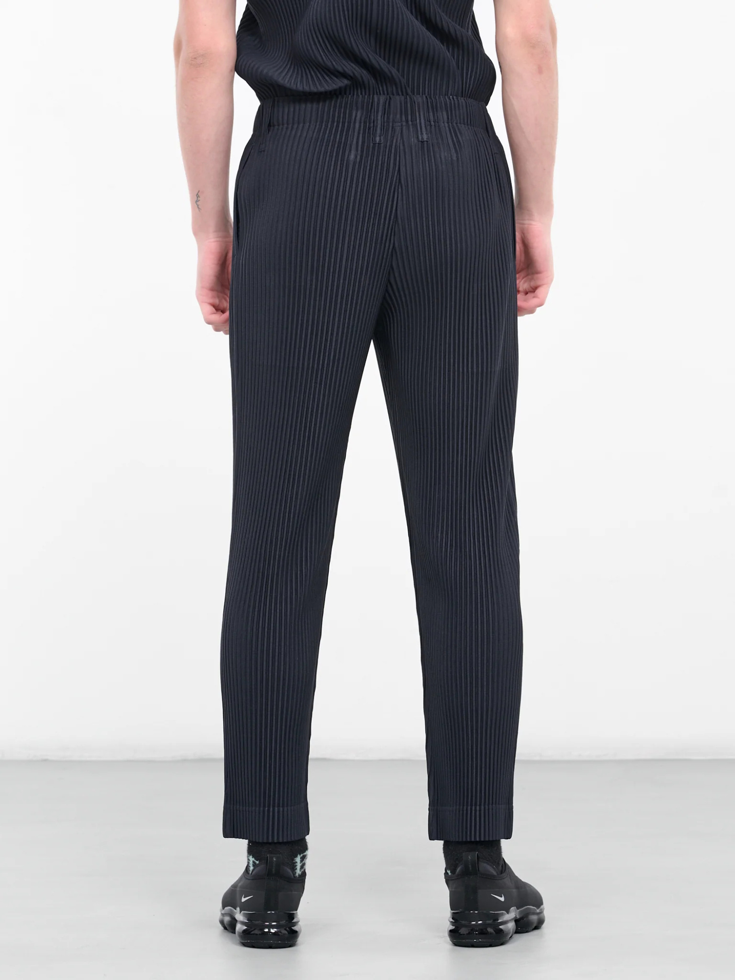 ISSEY MIYAKE BASIC TAPERED PLISSÉ TROUSERS