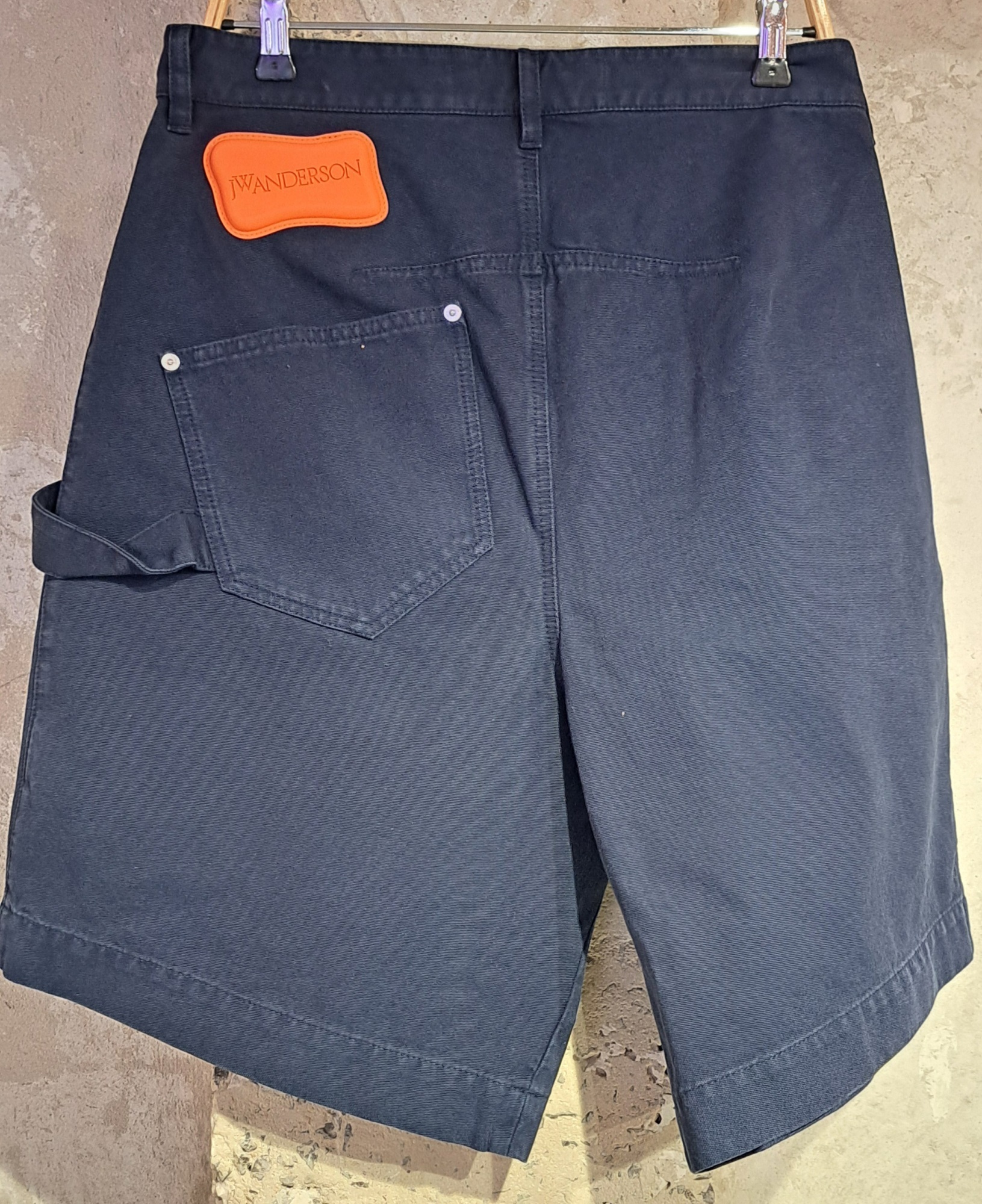 Jw Anderson Knee-length Twisted Bermuda Shorts In Black