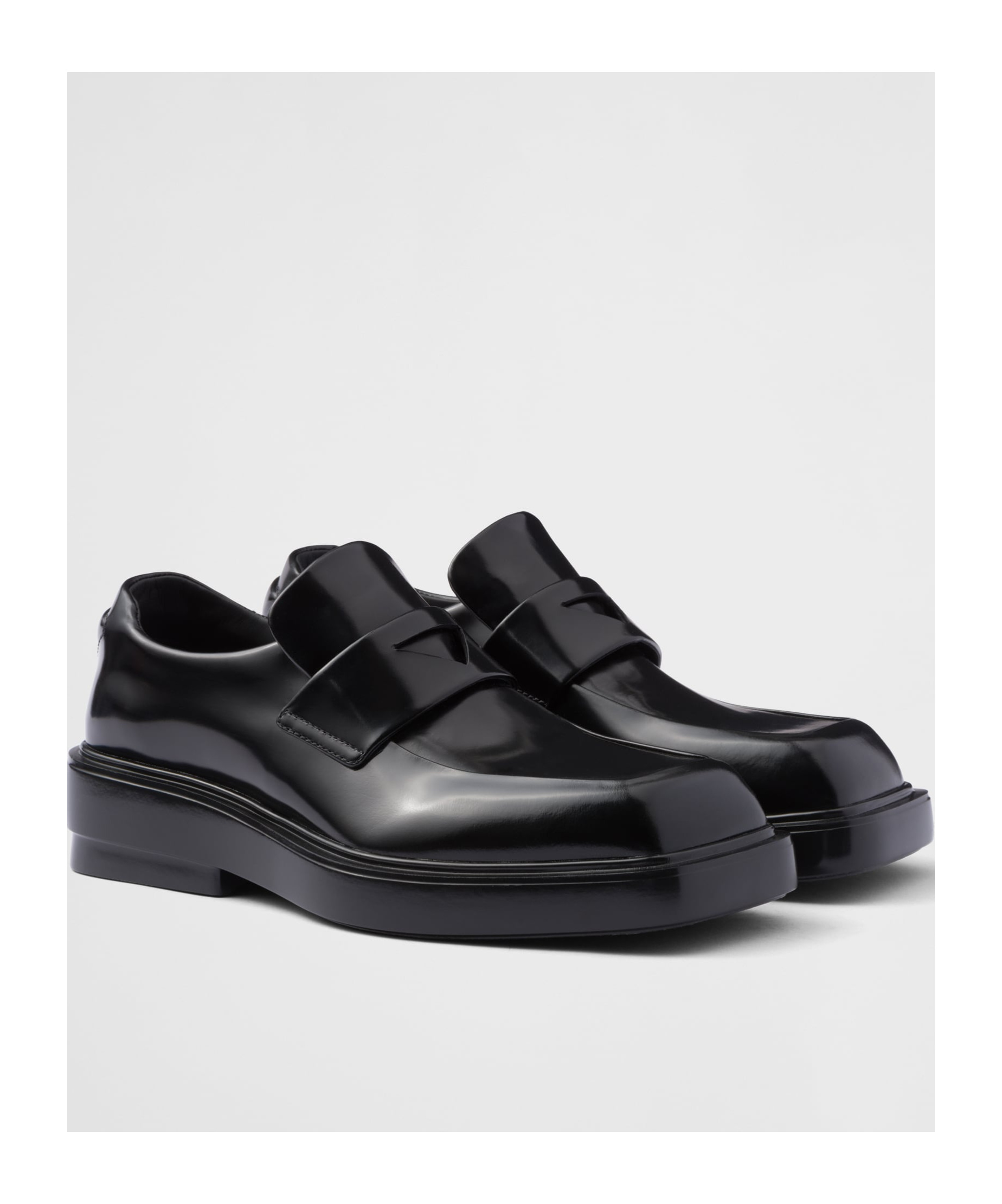 Prada Triangle Patch Leather Loafers In Black